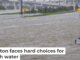 A roadside assistance vehicle is swamped by floodwaters on a Houston highway in 2024. Brandon Bell/Getty Images